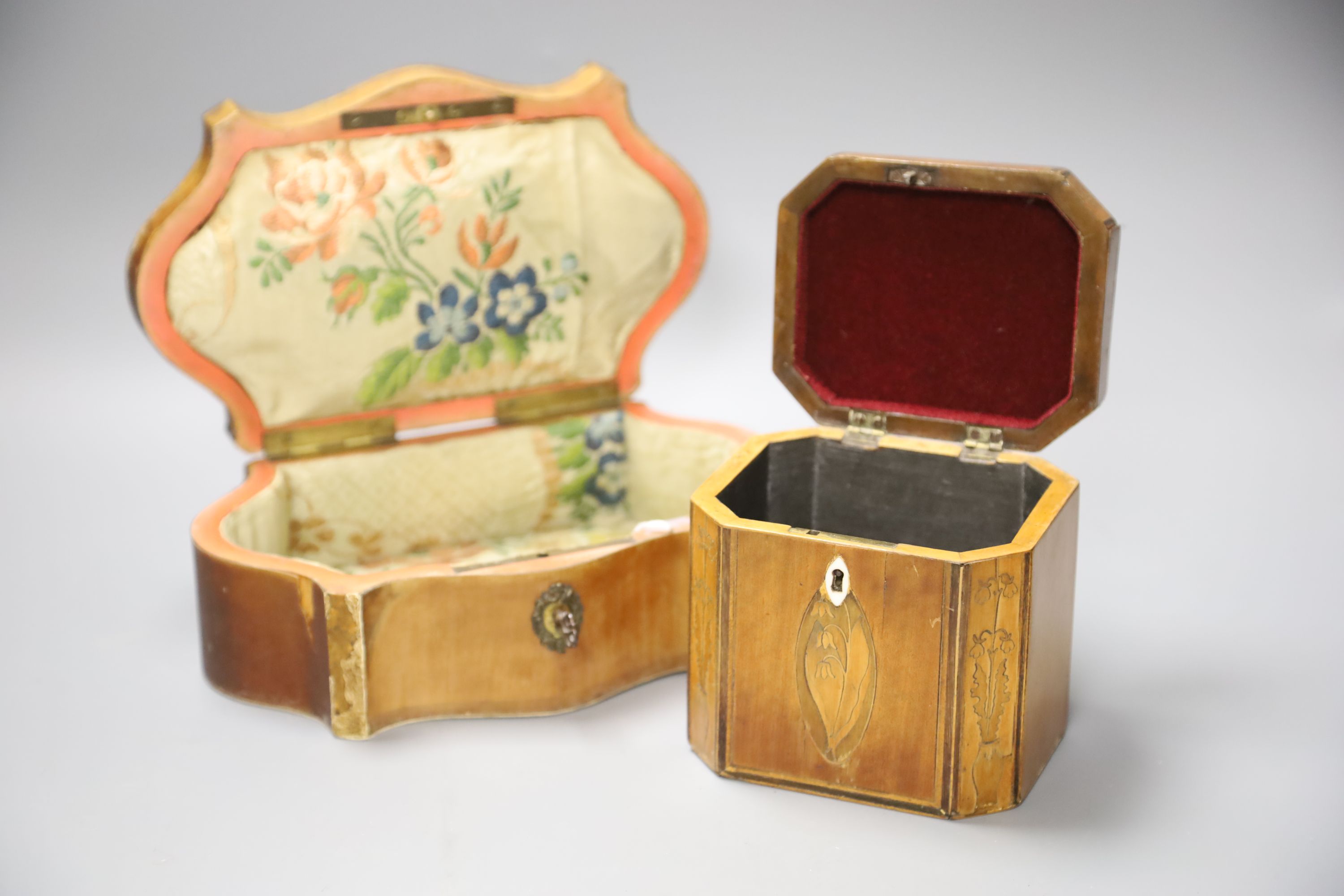 A marquetry serpentine work box, length 23.5cm, and an octagonal tea caddy